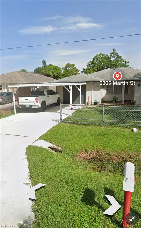 5305 Martin Street Naples, FL 34113 - Photo 1 of 1 a view of a house with a yard