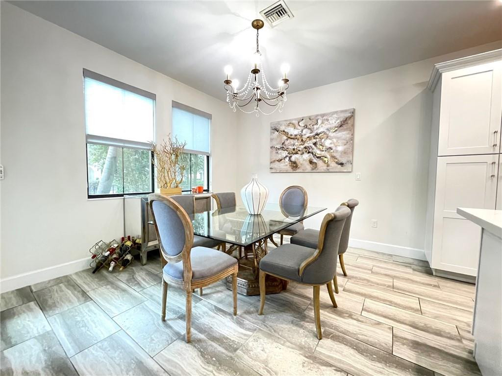 Undisclosed Address Sunrise, FL 33323 - Photo 16 of 88 a view of a dining room with furniture window and wooden floor