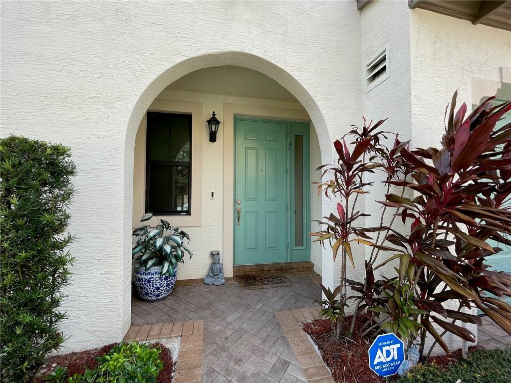 Undisclosed Address Sunrise, FL 33323 - Photo 3 of 88 a front view of a house with lots of yellow lighting