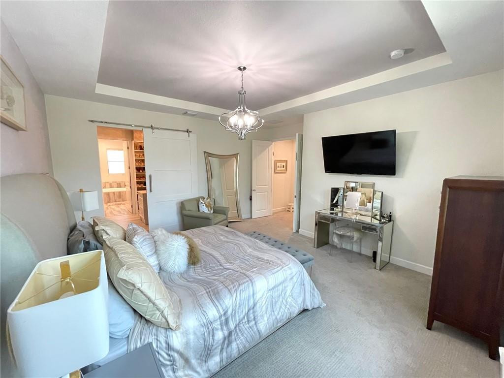 Undisclosed Address Sunrise, FL 33323 - Photo 32 of 88 a bedroom with a bed and a flat screen tv