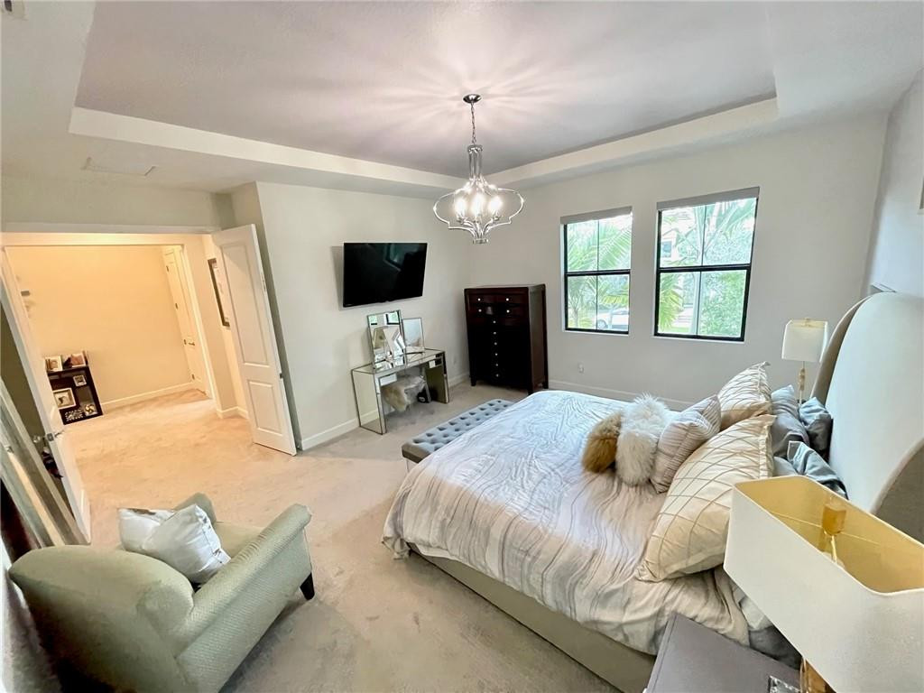 Undisclosed Address Sunrise, FL 33323 - Photo 38 of 88 a bedroom with a bed window and a flat screen tv