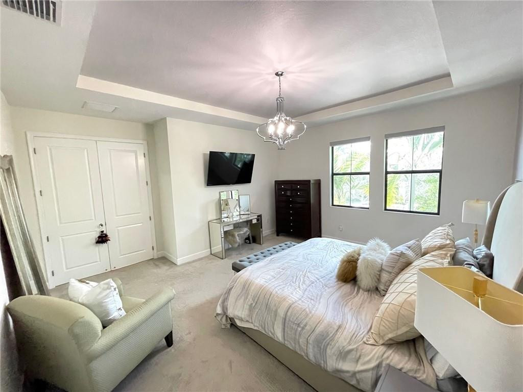 Undisclosed Address Sunrise, FL 33323 - Photo 39 of 88 a bedroom with a bed couch and a window