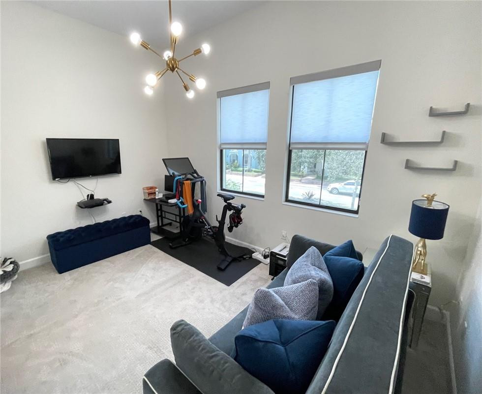 Undisclosed Address Sunrise, FL 33323 - Photo 61 of 88 a living room with furniture and a flat screen tv