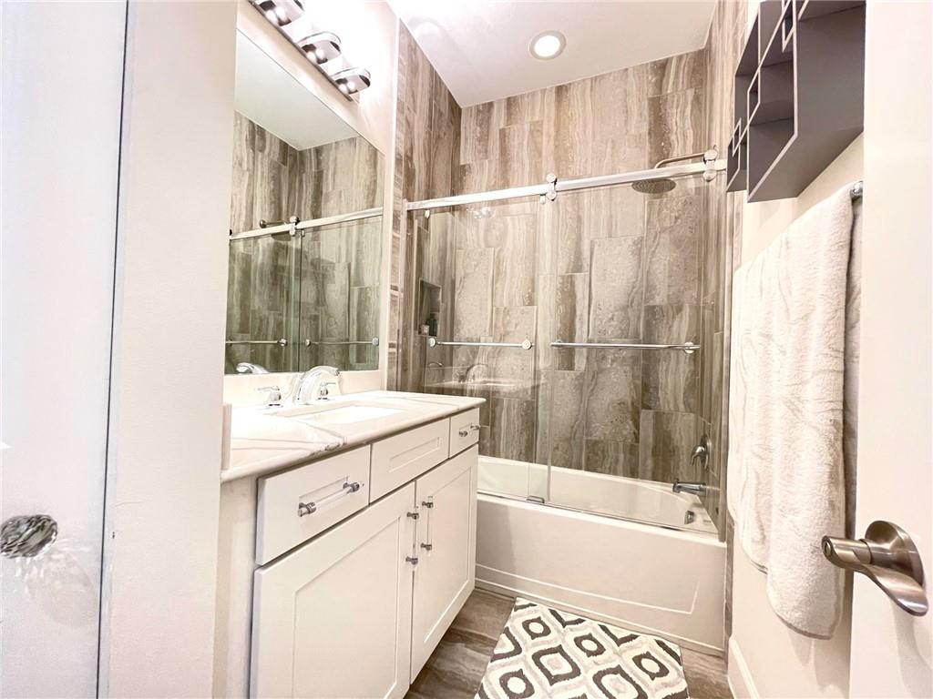 Undisclosed Address Sunrise, FL 33323 - Photo 67 of 88 a bathroom with a granite countertop sink mirror bathtub and shower