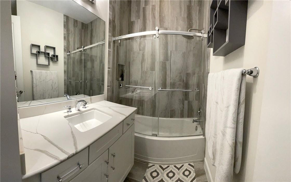 Undisclosed Address Sunrise, FL 33323 - Photo 68 of 88 a bathroom with a sink a mirror and a bathtub