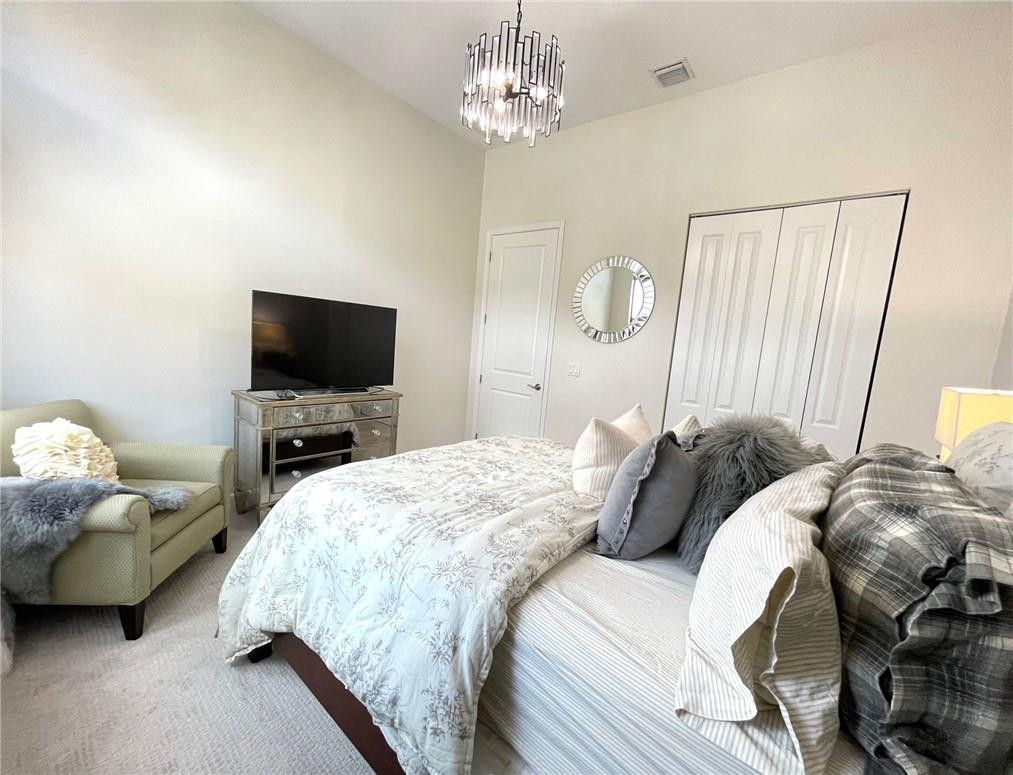 Undisclosed Address Sunrise, FL 33323 - Photo 73 of 88 a bedroom with a bed and a flat screen tv