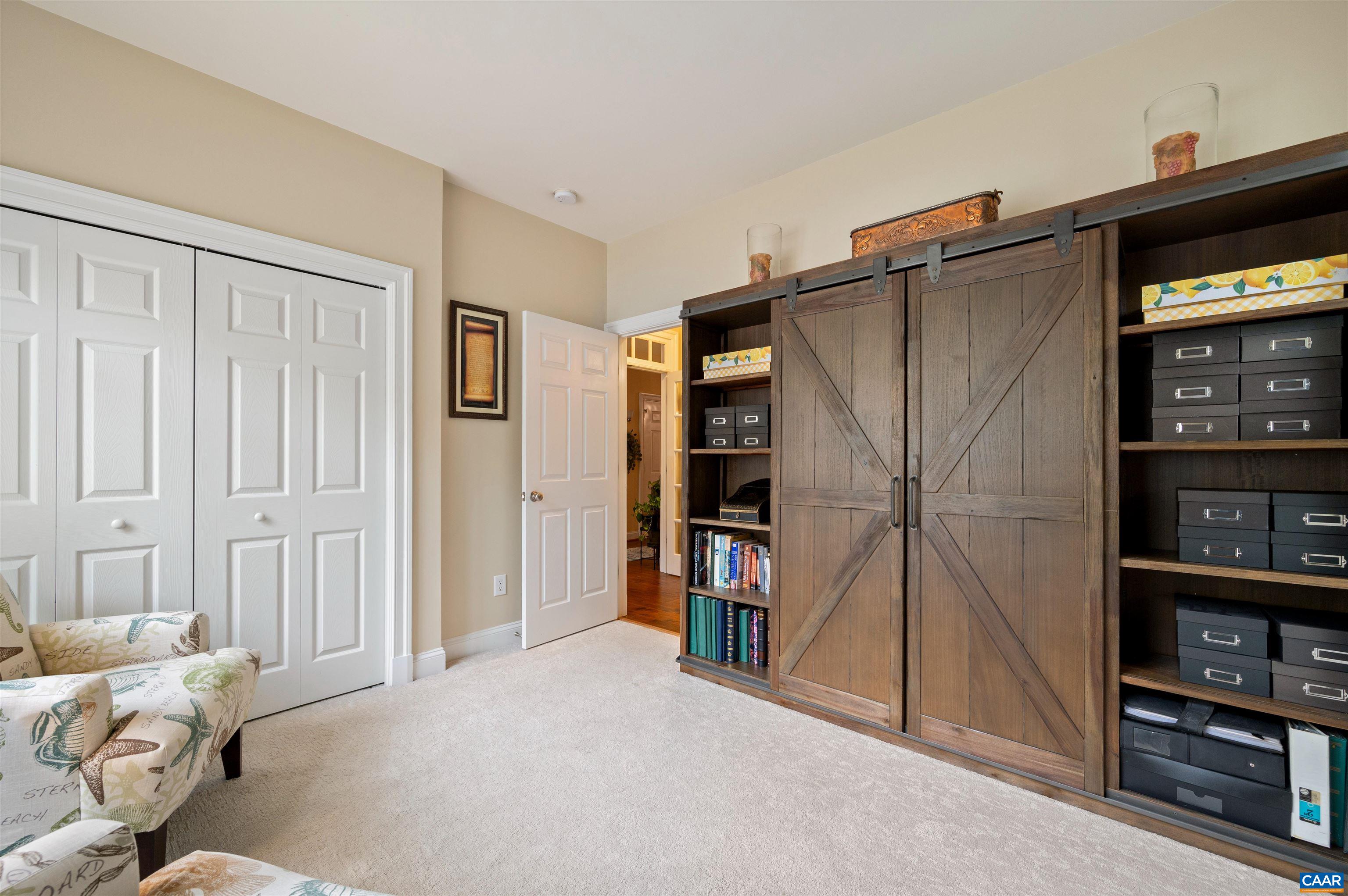 4618 Mechums River Road Charlottesville, VA 22901 - Photo 12 of 44 a livingroom with a book shelf
