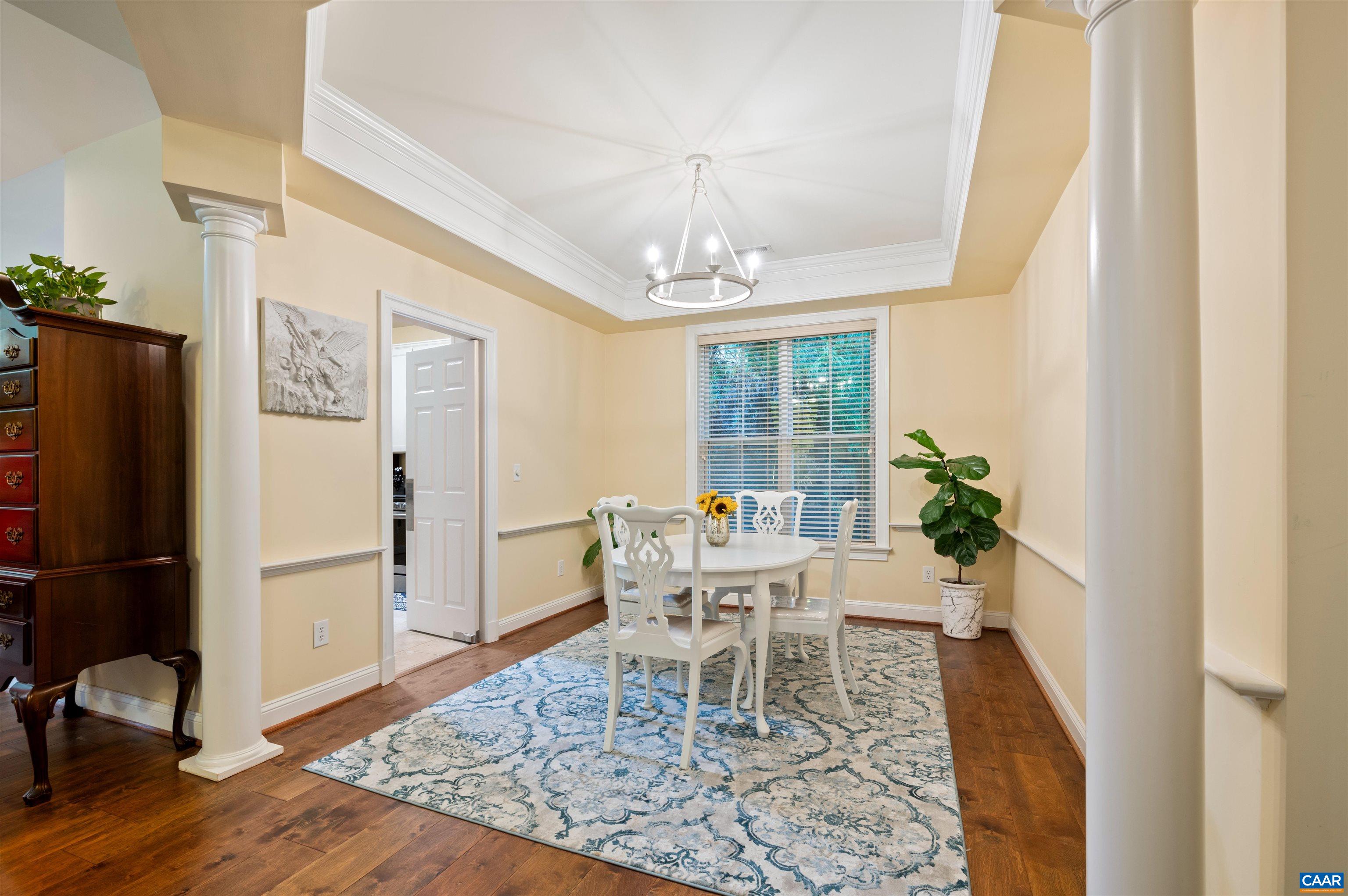 4618 Mechums River Road Charlottesville, VA 22901 - Photo 17 of 44 a view of a dining room with furniture window and wooden floor