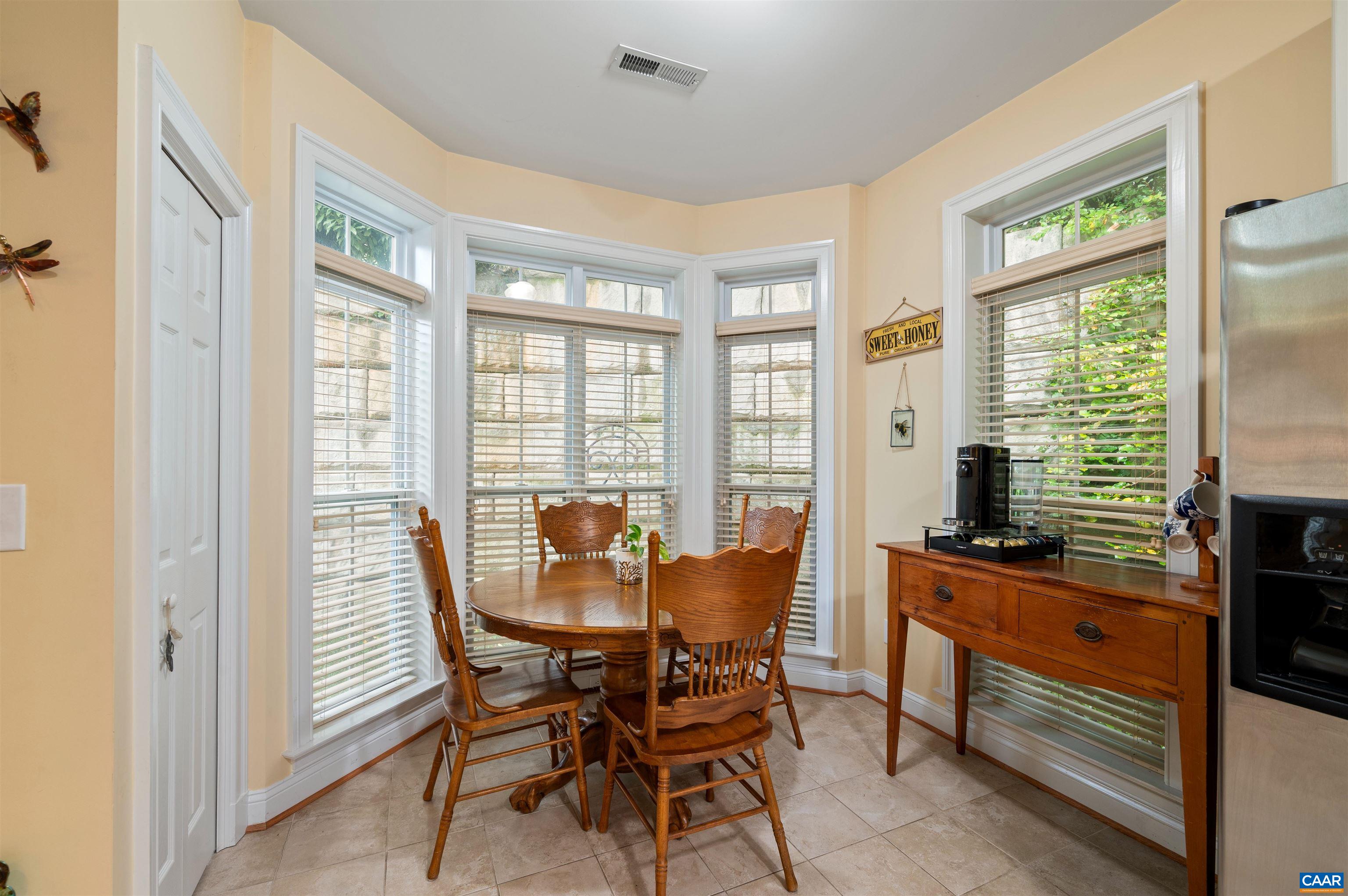 4618 Mechums River Road Charlottesville, VA 22901 - Photo 30 of 44 a dining room with furniture and windows