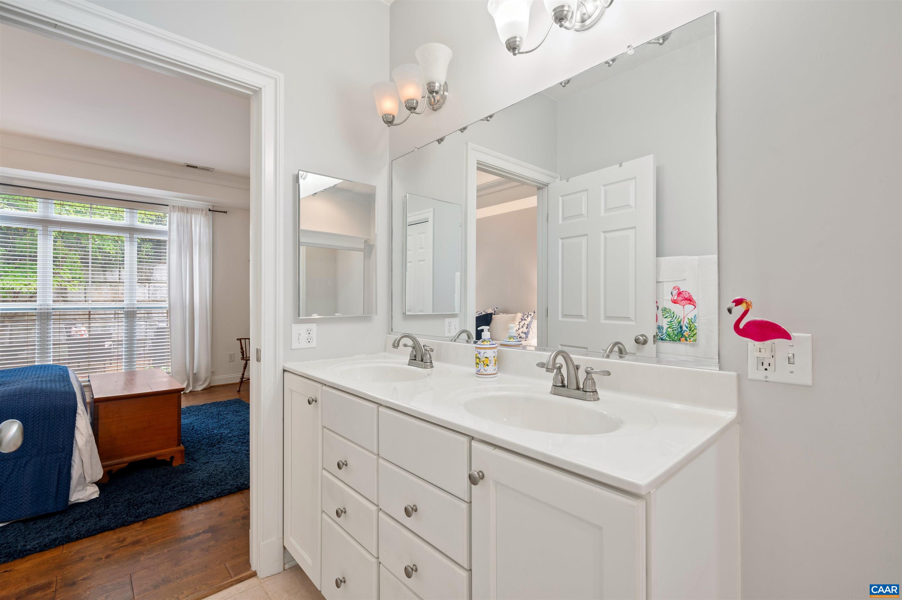 4618 Mechums River Road Charlottesville, VA 22901 - Photo 33 of 44 a bathroom with a sink vanity tub and a mirror