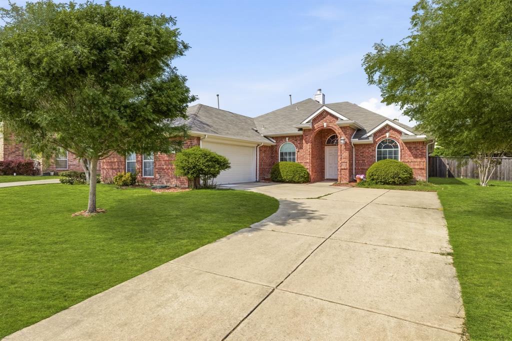 2210 High Point Drive Sachse, TX 75048 - Photo 1 of 23 a front view of house with yard and green space
