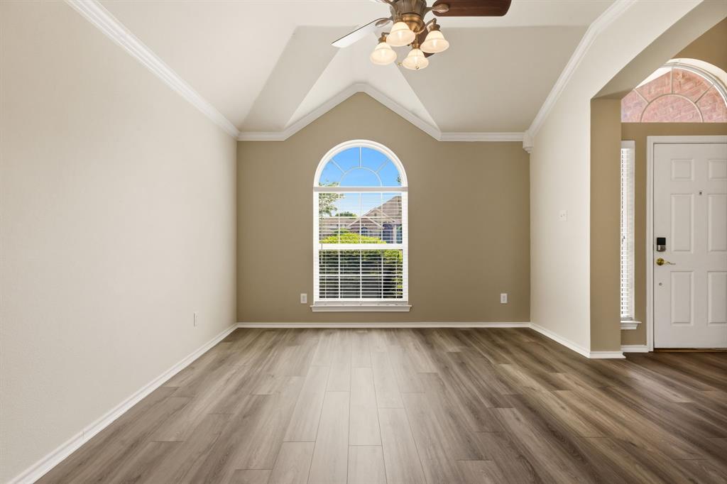 2210 High Point Drive Sachse, TX 75048 - Photo 3 of 23 wooden floor in an empty room with a window