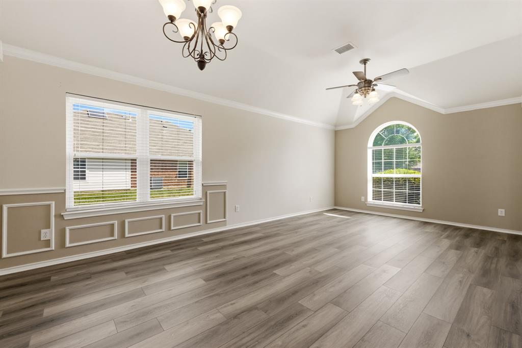 2210 High Point Drive Sachse, TX 75048 - Photo 4 of 23 a view of an empty room with a window and wooden floor
