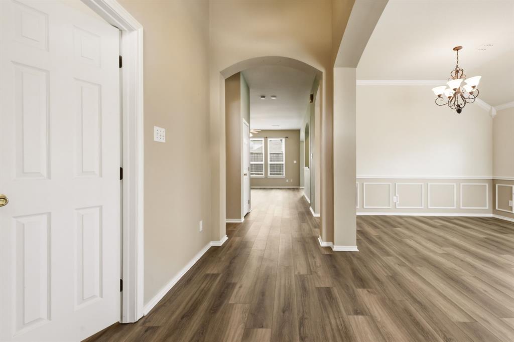 2210 High Point Drive Sachse, TX 75048 - Photo 5 of 23 a view of a hallway with wooden floor