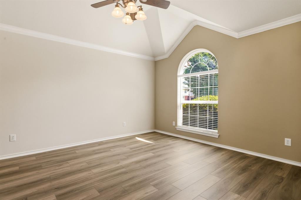 2210 High Point Drive Sachse, TX 75048 - Photo 6 of 23 a view of an empty room with wooden floor and a window