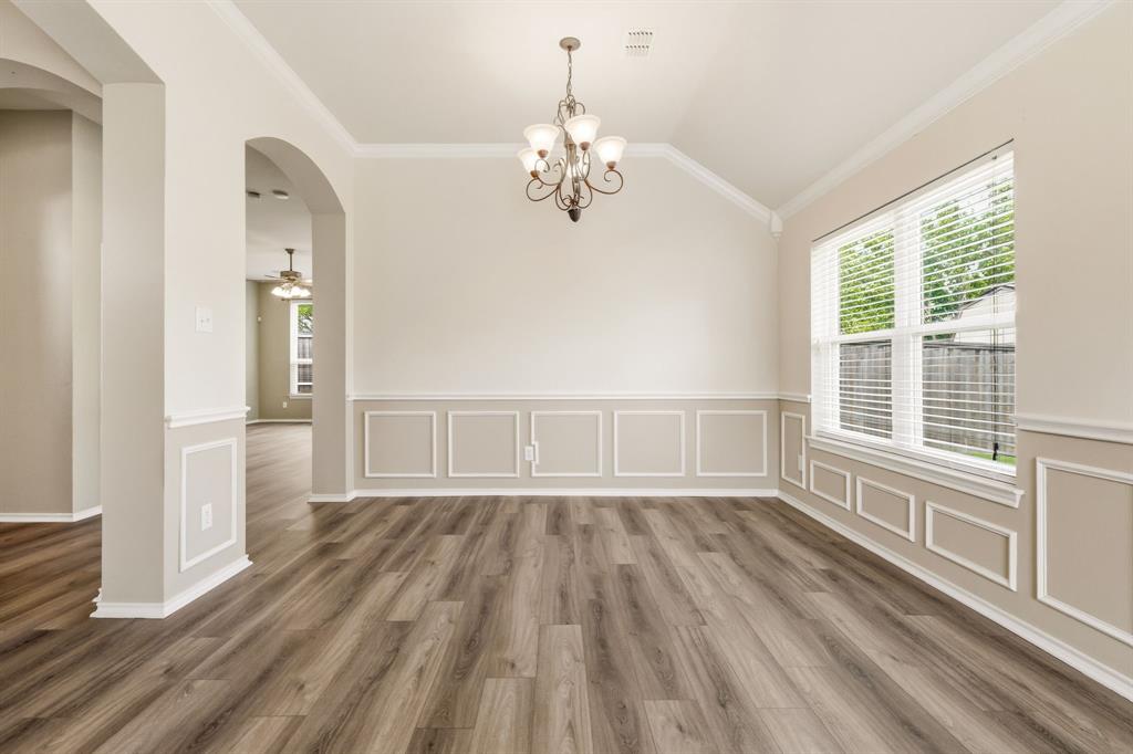 2210 High Point Drive Sachse, TX 75048 - Photo 7 of 23 wooden floor in an empty room with a window