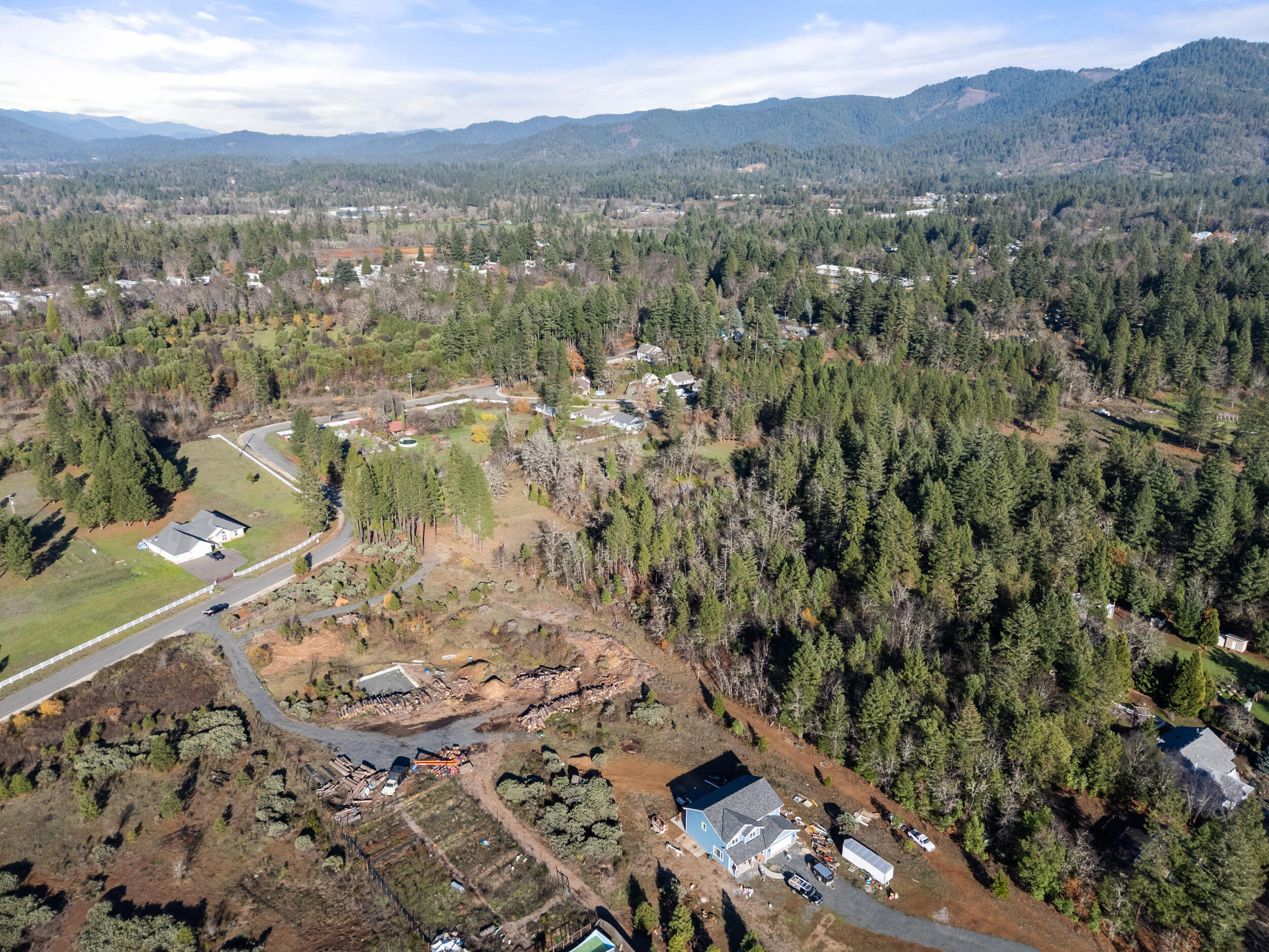681 Daisy Hill Road Cave Junction, OR 97523 - Photo 6 of 26 a view of a city with a mountain
