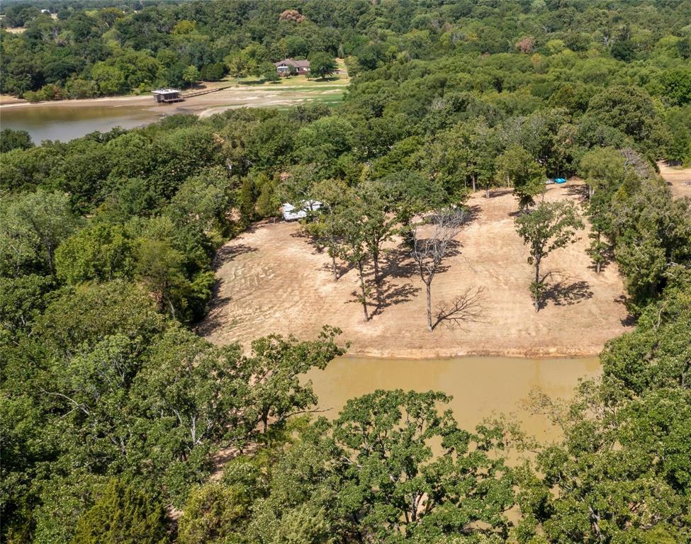 7204 Lance Eustace, TX 75124 - Photo 19 of 25 Bird's eye view with a water view and a forest view