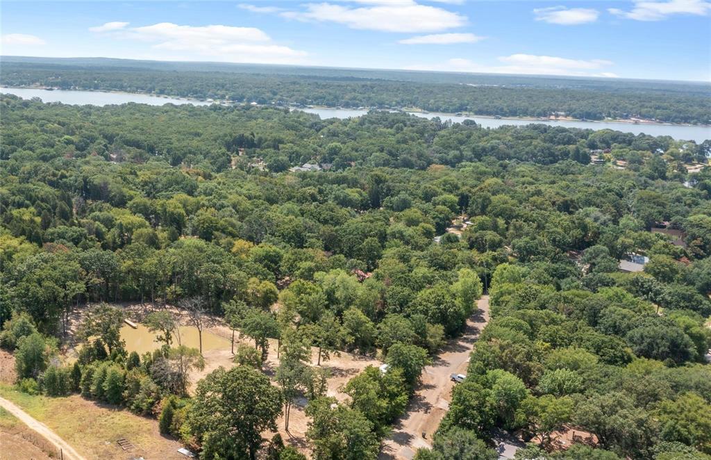7204 Lance Eustace, TX 75124 - Photo 21 of 25 Drone / aerial view with a water view and a wooded view