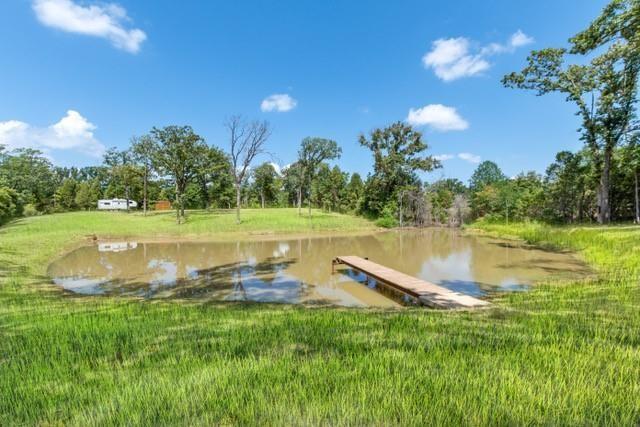 7204 Lance Eustace, TX 75124 - Photo 23 of 25 Dock area with a water view and a yard