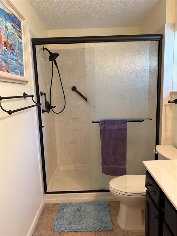 9529 Southwest 85th Avenue, Unit D Ocala, FL 34481 - Photo 13 of 21 a bathroom with a shower a toilet and a shower