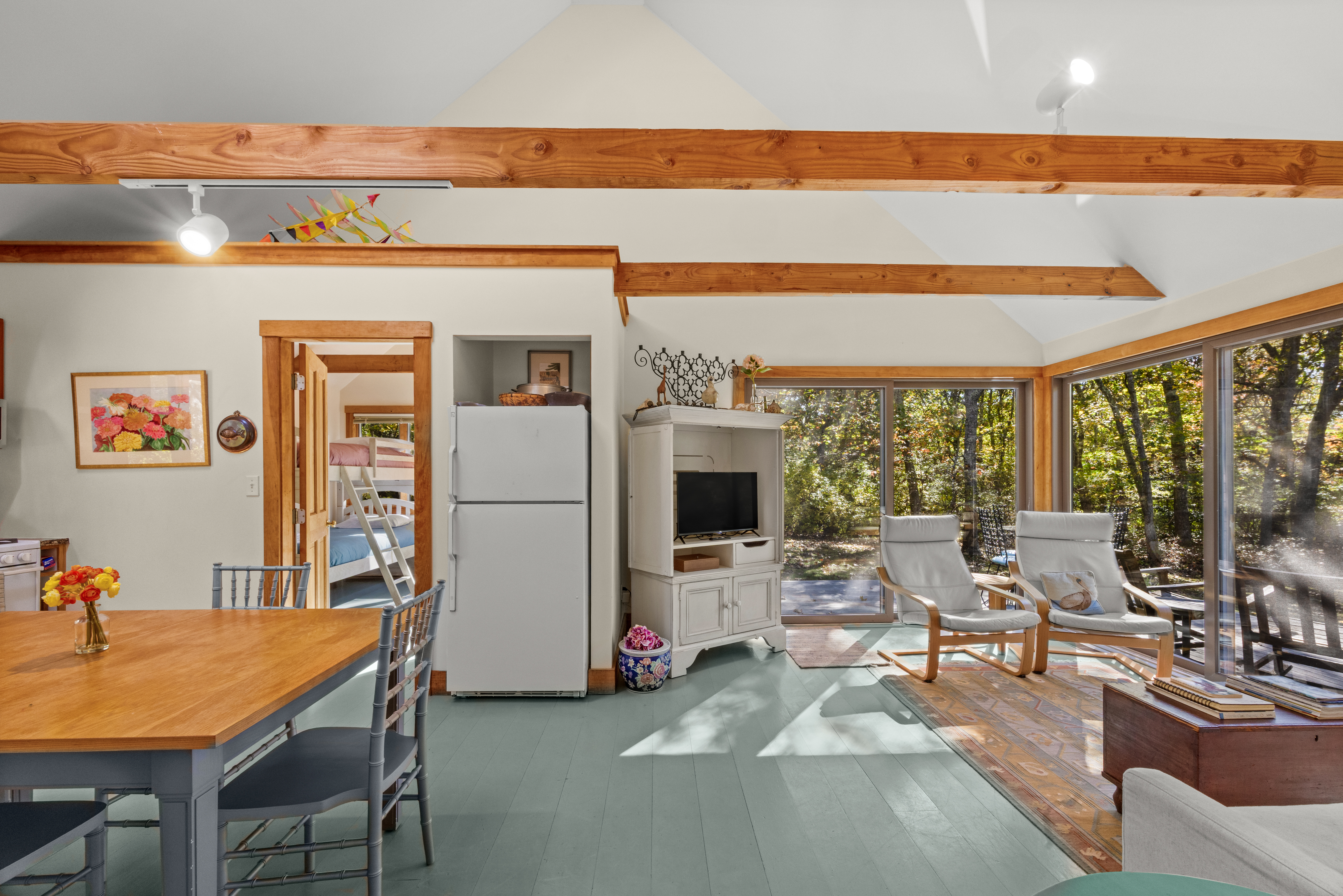 46 Tiercel Lane Chilmark, MA 02535 - Photo 12 of 20 a living room with furniture a flat screen tv and a floor to ceiling window
