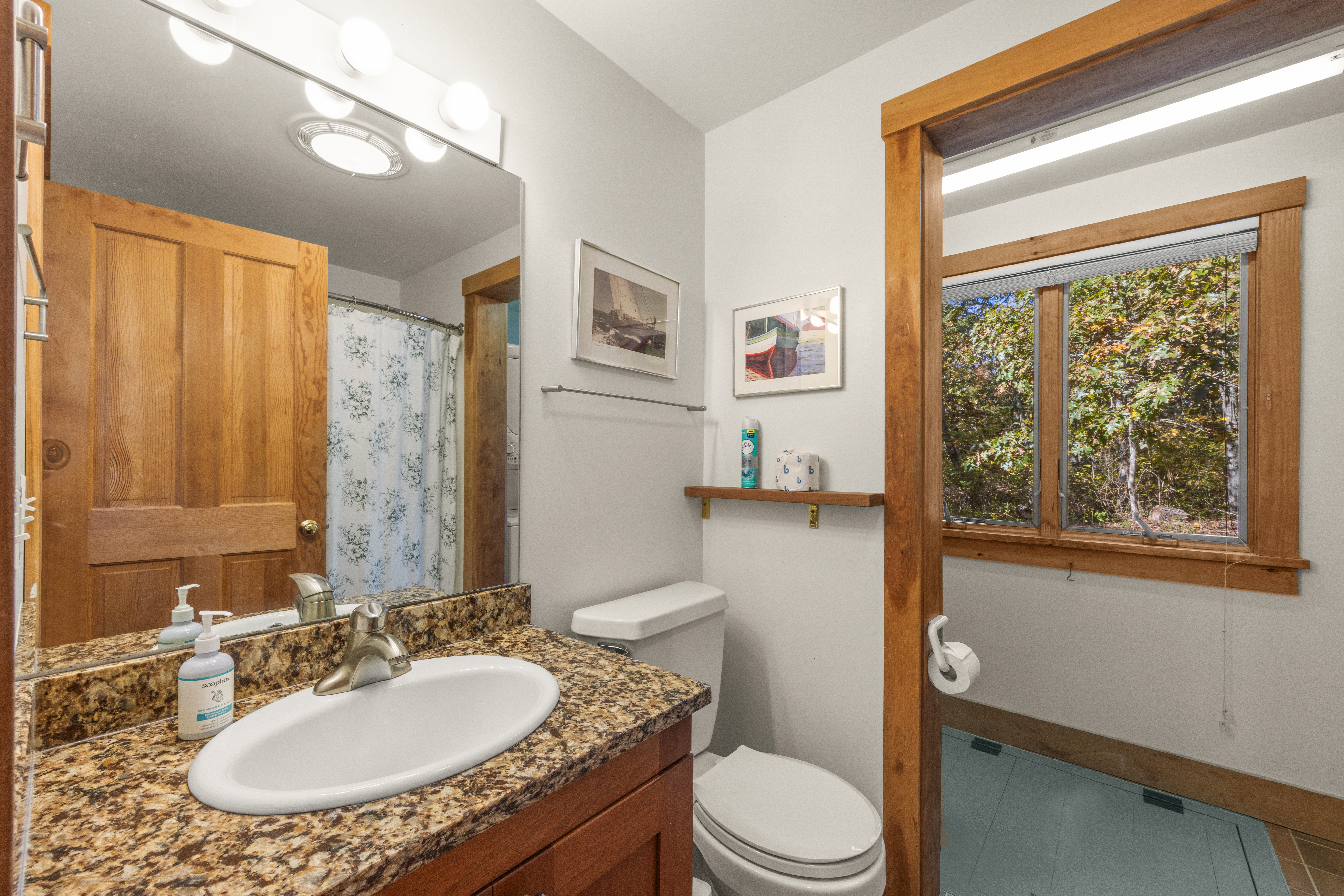 46 Tiercel Lane Chilmark, MA 02535 - Photo 16 of 20 a bathroom with a granite countertop sink toilet a mirror a vanity and shower