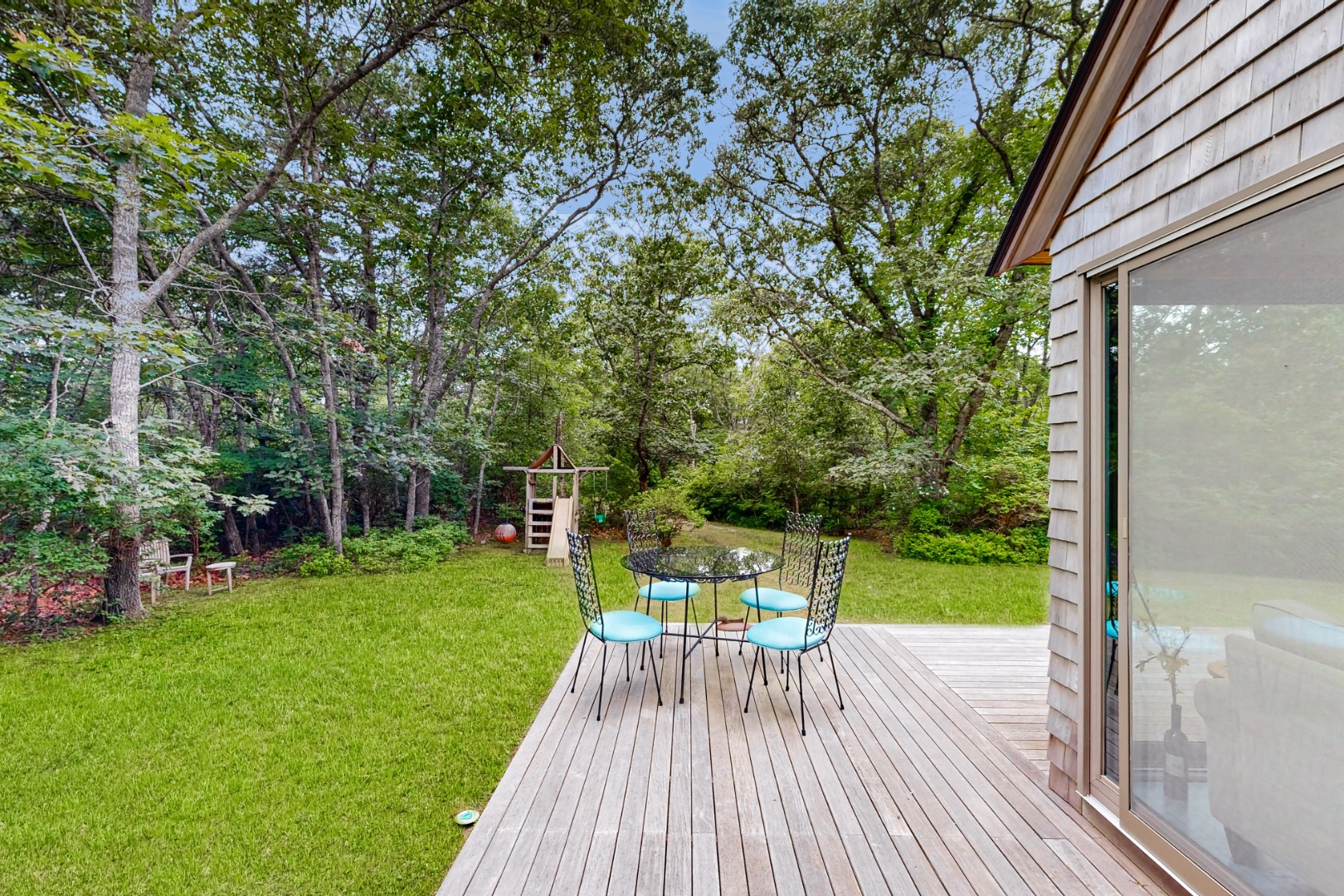 46 Tiercel Lane Chilmark, MA 02535 - Photo 20 of 20 a view of a deck with chair and garden