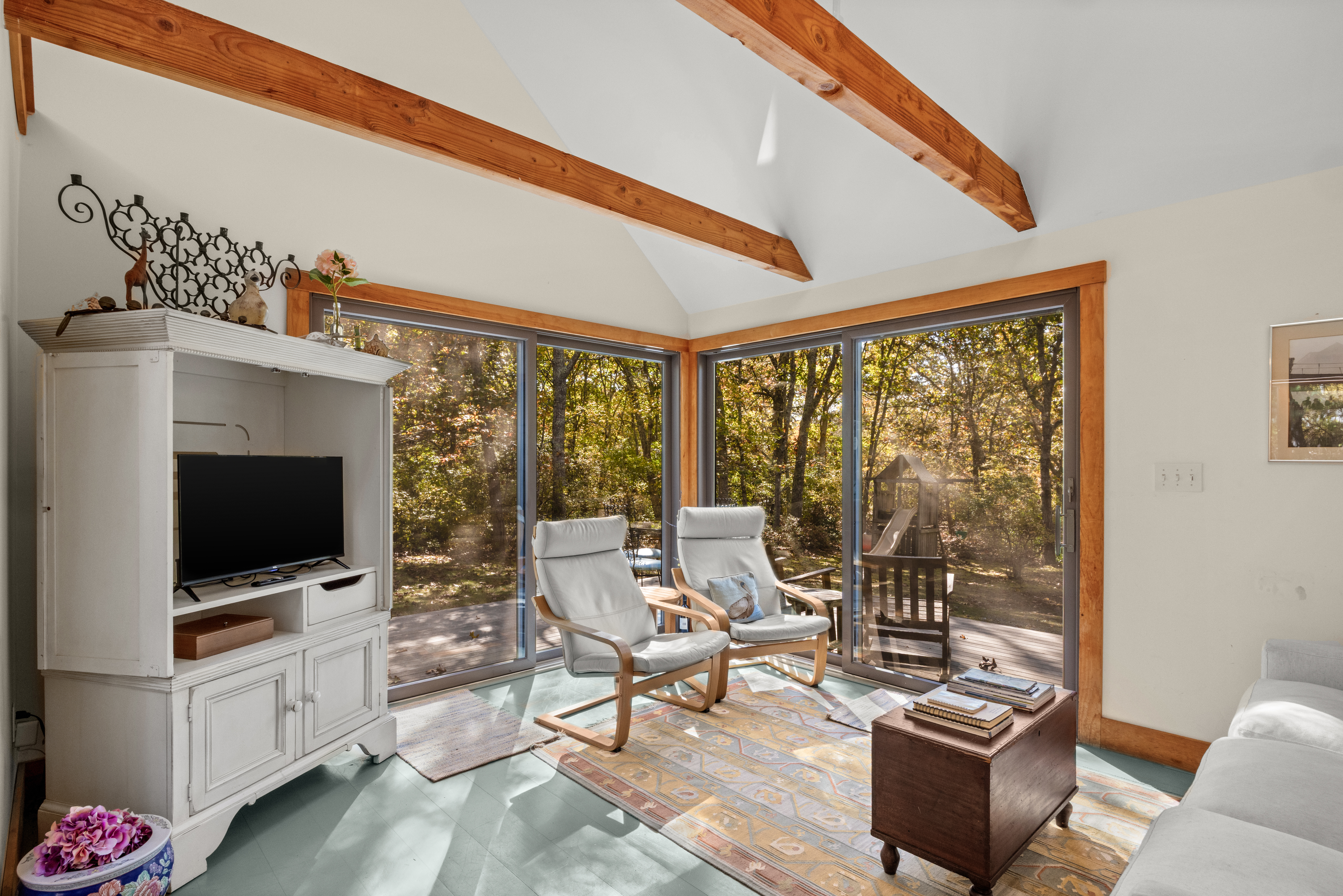 46 Tiercel Lane Chilmark, MA 02535 - Photo 4 of 20 a living room with furniture a flat screen tv and floor to ceiling window