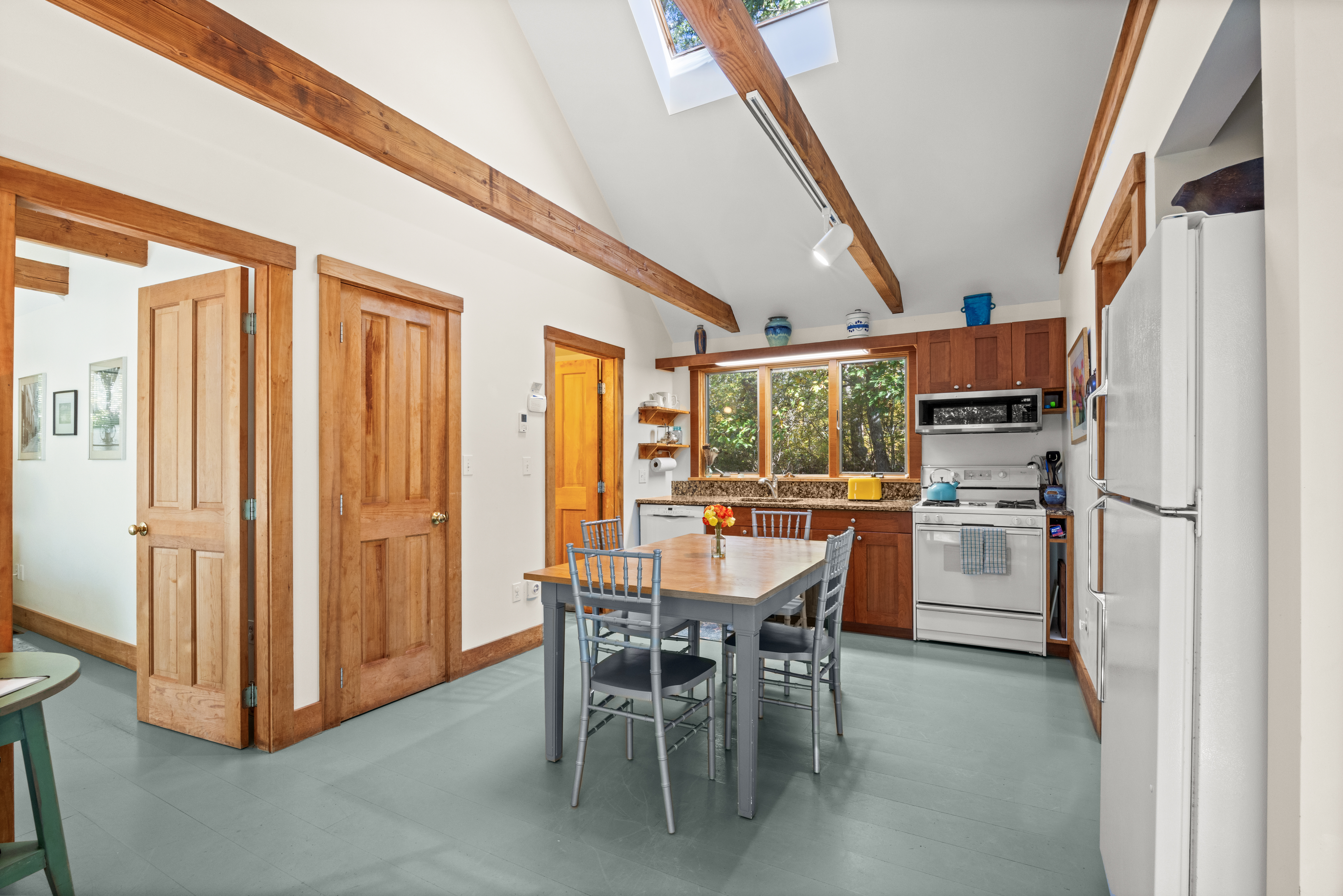 46 Tiercel Lane Chilmark, MA 02535 - Photo 6 of 20 a dining area with furniture a kitchen view and a refrigerator
