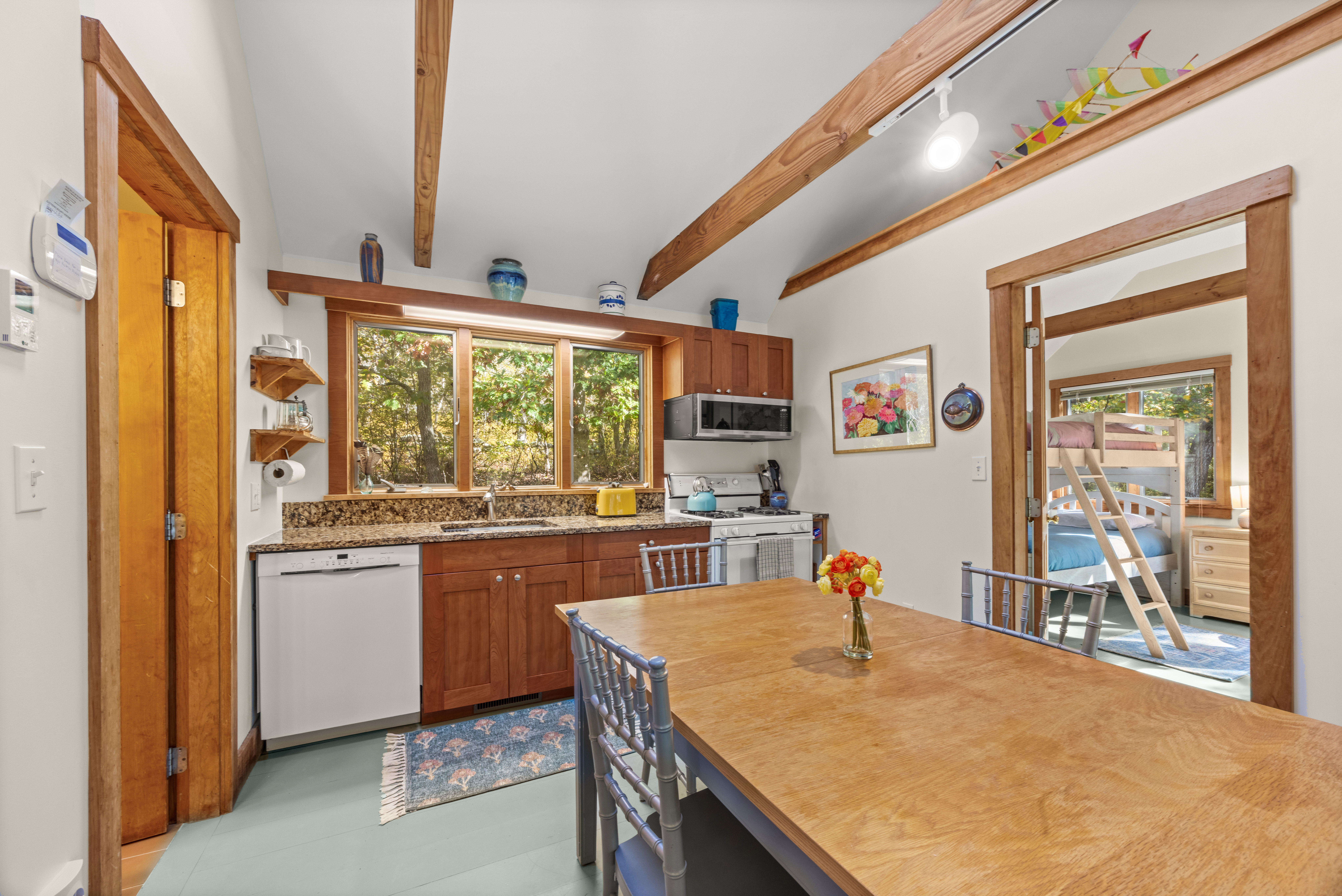 46 Tiercel Lane Chilmark, MA 02535 - Photo 8 of 20 a open kitchen with stainless steel appliances granite countertop table chairs and a large window