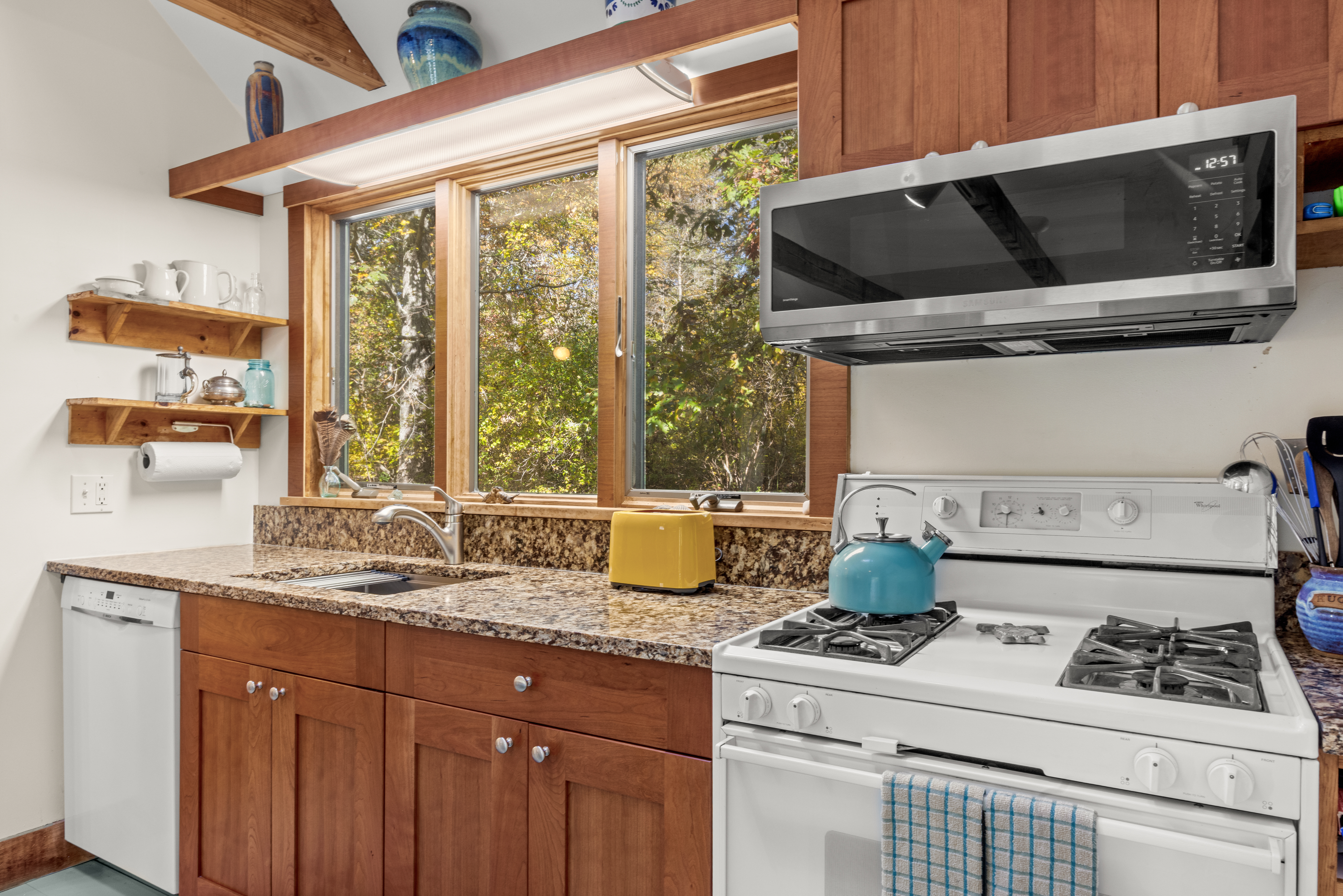 46 Tiercel Lane Chilmark, MA 02535 - Photo 9 of 20 a kitchen with a stove a microwave and cabinets