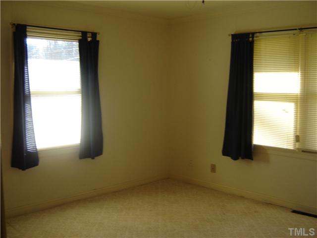 815 Goodwin Road Durham, NC 27712 - Photo 11 of 15 an empty room with a window