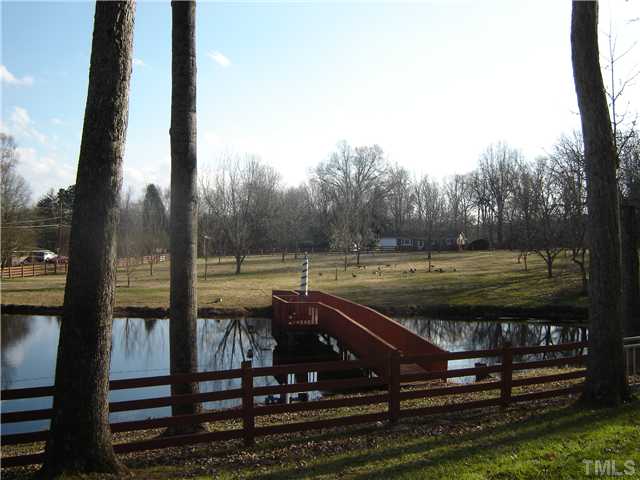 815 Goodwin Road Durham, NC 27712 - Photo 5 of 15 a view of a lake from a yard