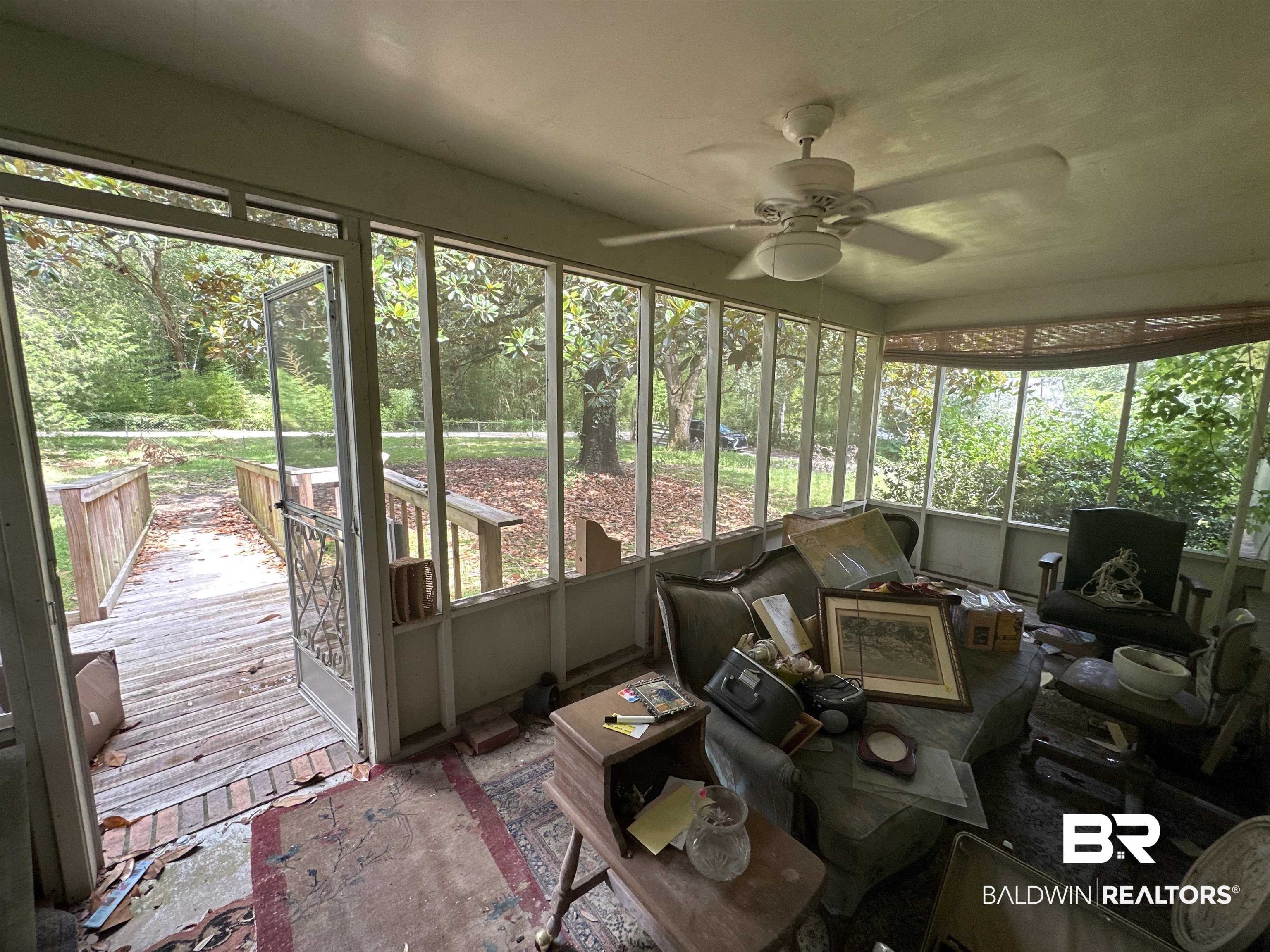 1850 Repoll Drive Mobile, AL 36695 - Photo 11 of 26 Sunroom / solarium with ceiling fan and plenty of natural light