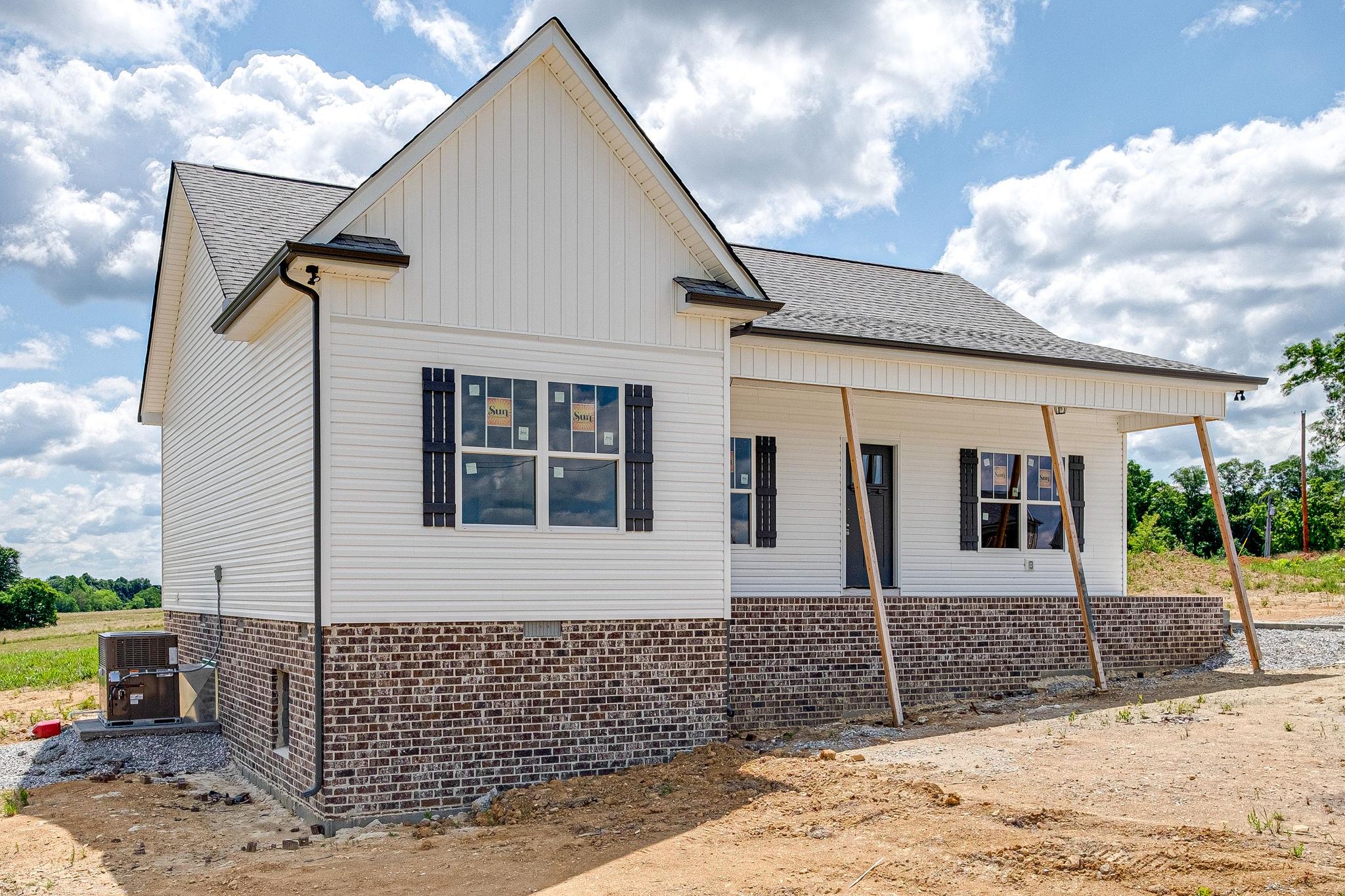 1195 Liberty Road Charlotte, TN 37036 - Photo 23 of 27 Long Covered Front Porch