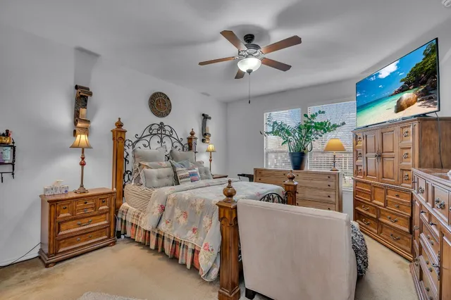 a bed room with furniture and a flat screen tv