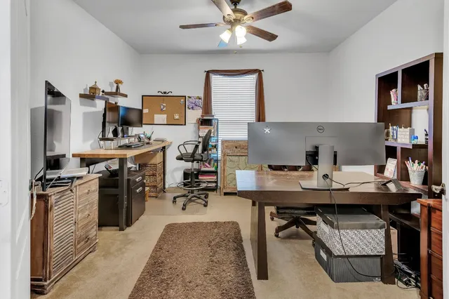 a kitchen with a stove a refrigerator and a dining table