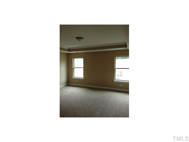 3509 Eastern Branch Road Raleigh, NC 27610 - Photo 8 of 12 a view of an empty room with a window