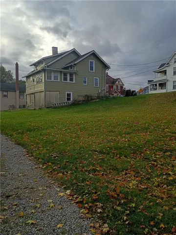a view of a house with a big yard