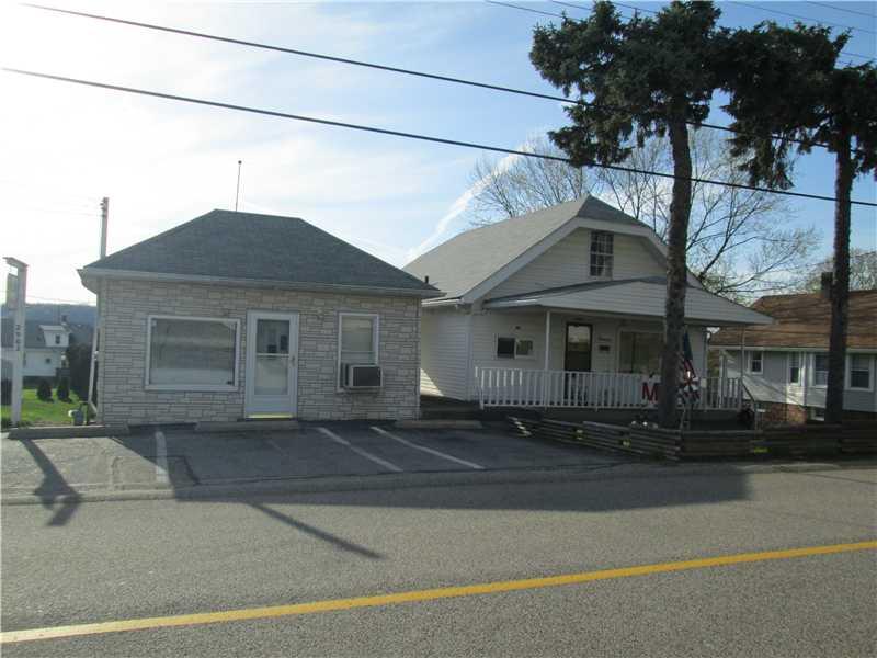 Exterior Front. Welcome Home!  A large front porch to enjoy morning coffee.  Additional building on property currently beauty salon