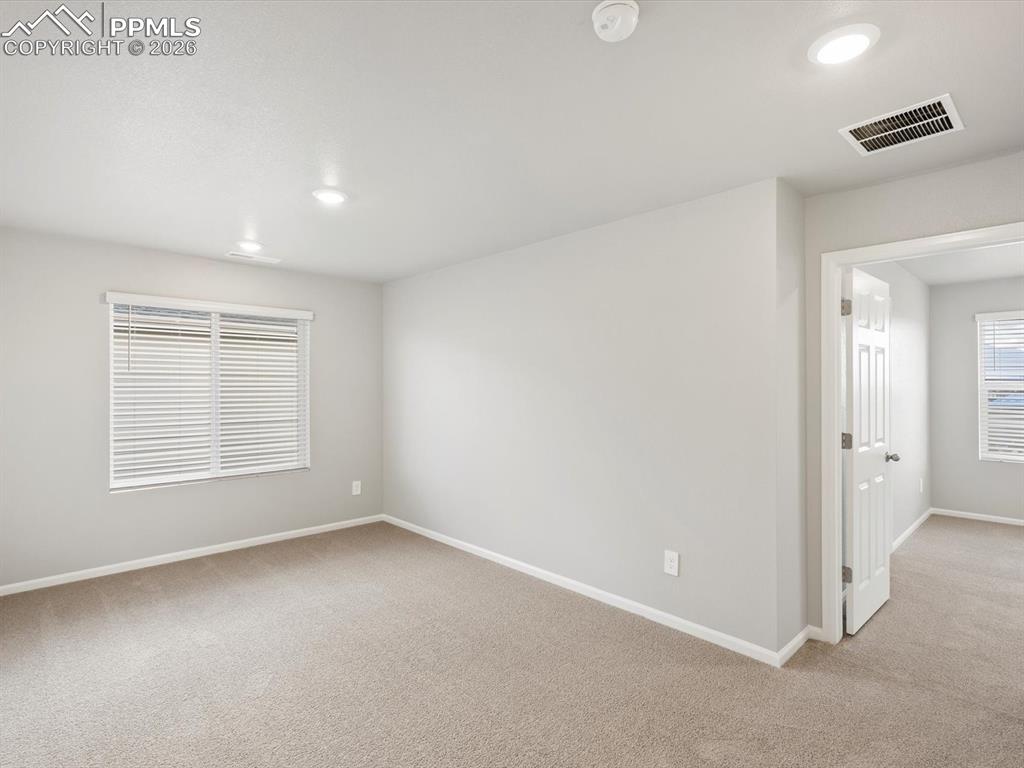 6754 Roundtail Way Colorado Springs, CO 80925 - Photo 18 of 31 an empty room with a window
