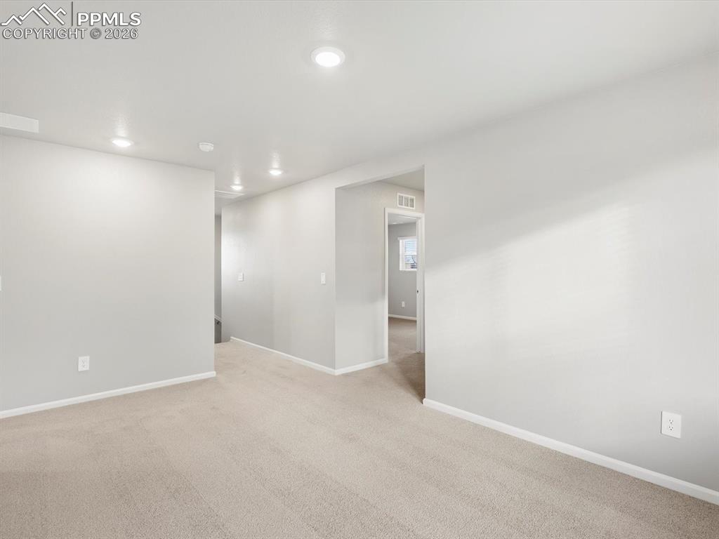6754 Roundtail Way Colorado Springs, CO 80925 - Photo 21 of 31 a view of an empty room