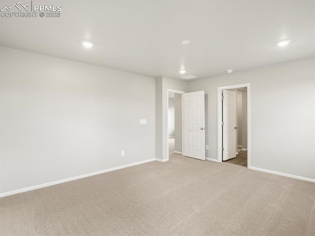 6754 Roundtail Way Colorado Springs, CO 80925 - Photo 23 of 31 a view of an empty room