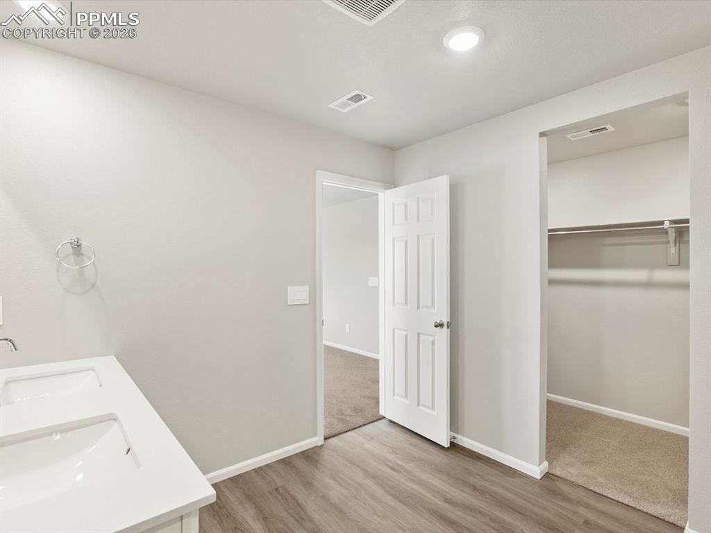 6754 Roundtail Way Colorado Springs, CO 80925 - Photo 25 of 31 a view of a storage & utility room with a washer dryer