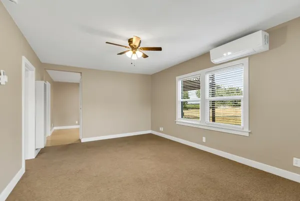 a view of an empty room with a window