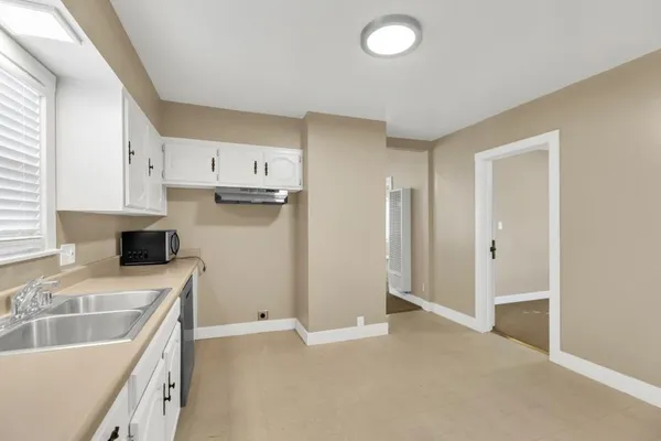 a view of an empty room with a window