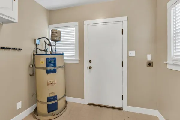 an empty room with a empty space and a ceiling fan