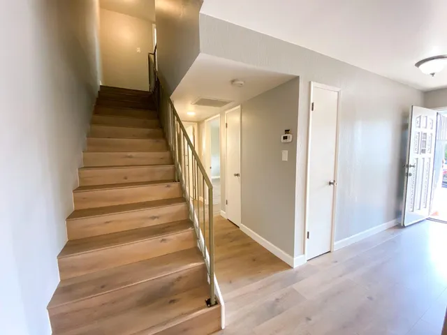 a bathroom with a double vanity sink toilet and shower