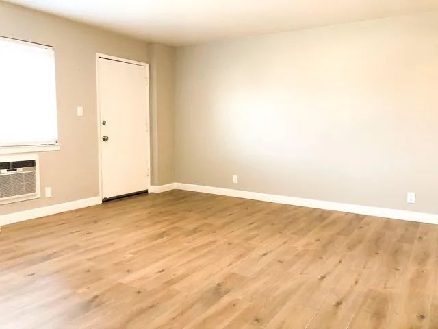 a view of kitchen with granite countertop cabinets and black appliances